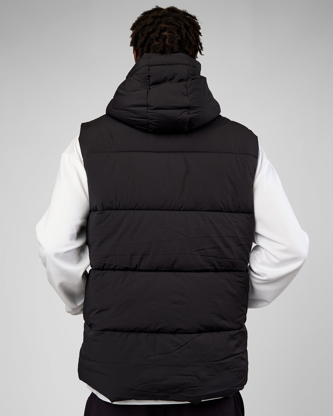 Man wearing Base Puffer Vest - Black | Model:Okello | Size:L - view 4