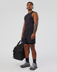 Man wearing BaseTech 8" Shorts - Black | Model:Xav | Size:L | Thumbnail Index: 6