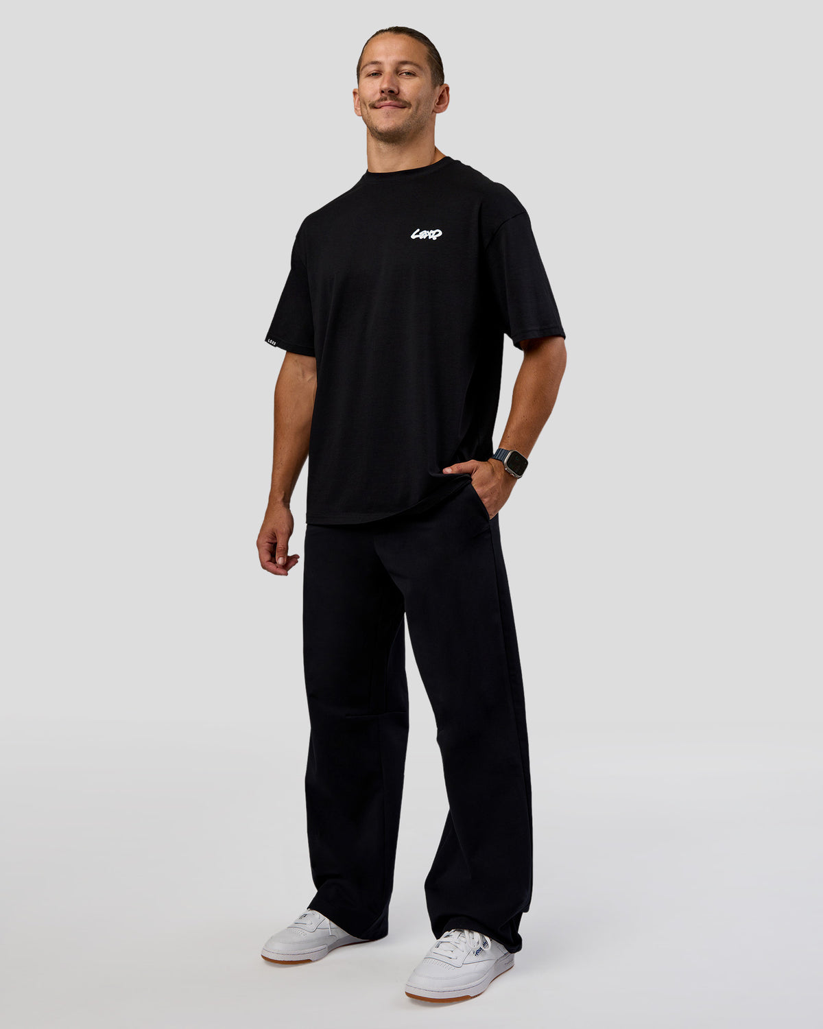 Man wearing Break Through FLXCotton Oversized Tee - Black-Open Air | Model:Jaiden | Size:L