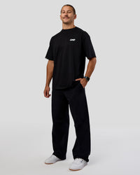 Man wearing Break Through FLXCotton Oversized Tee - Black-Open Air | Model:Jaiden | Size:L | Thumbnail Index: 1