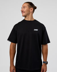 Man wearing Break Through FLXCotton Oversized Tee - Black-Open Air | Model:Jaiden | Size:L | Thumbnail Index: 4