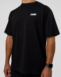 Man wearing Break Through FLXCotton Oversized Tee - Black-Open Air | Model:Jaiden | Size:L | Thumbnail Index: 6