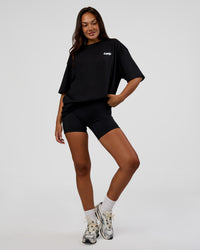 Woman wearing Break Through FLXCotton Oversized Tee - Black-Open Air | Model:Kirstyn | Size:L | Thumbnail Index: 5