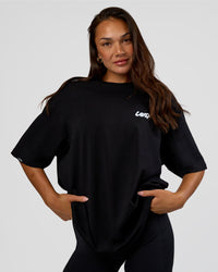 Woman wearing Break Through FLXCotton Oversized Tee - Black-Open Air | Model:Kirstyn | Size:L | Thumbnail Index: 3