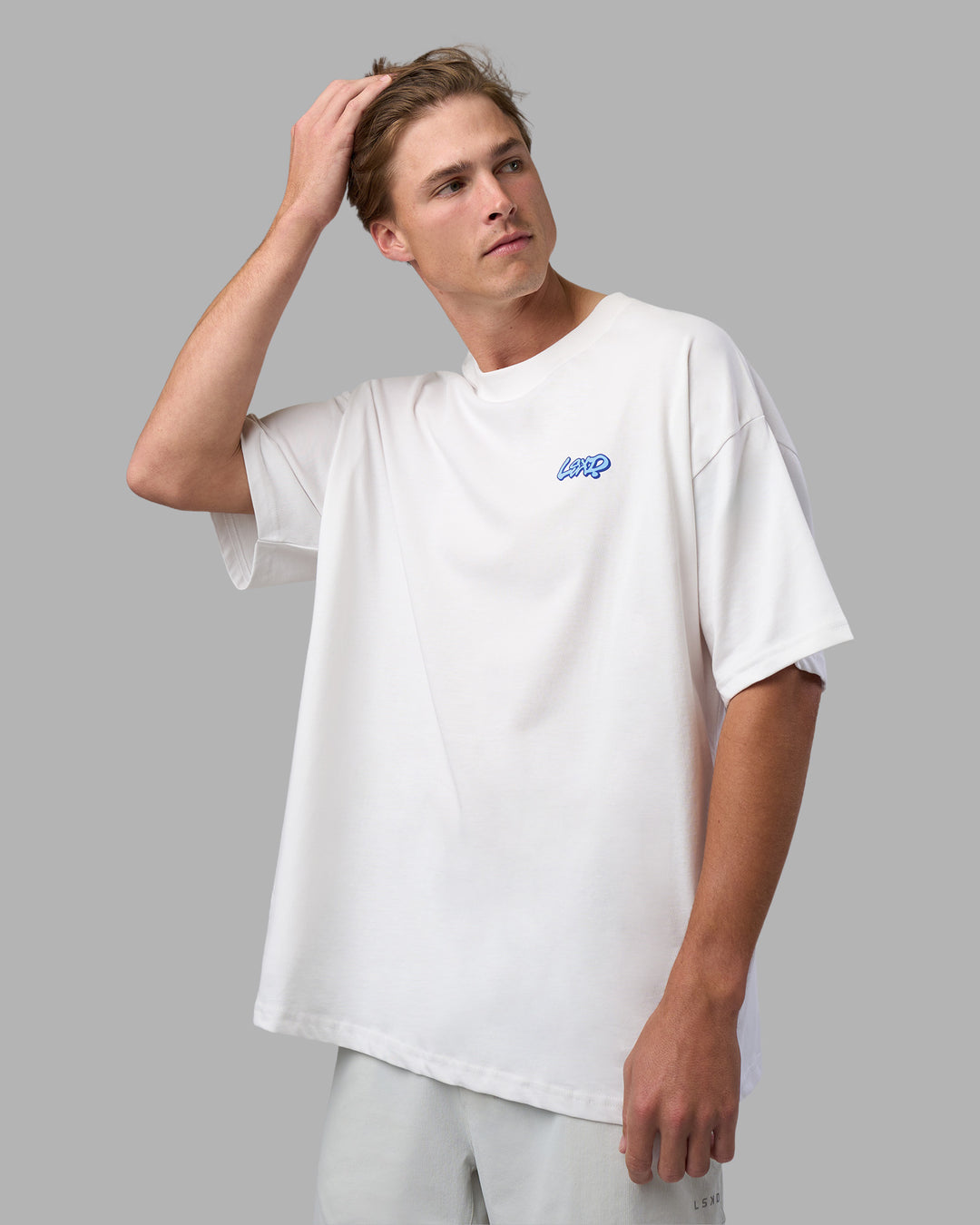 Man wearing Break Through Heavyweight Oversized Tee - White-Power Cobalt | Model:Brandon | Size:L - view 7