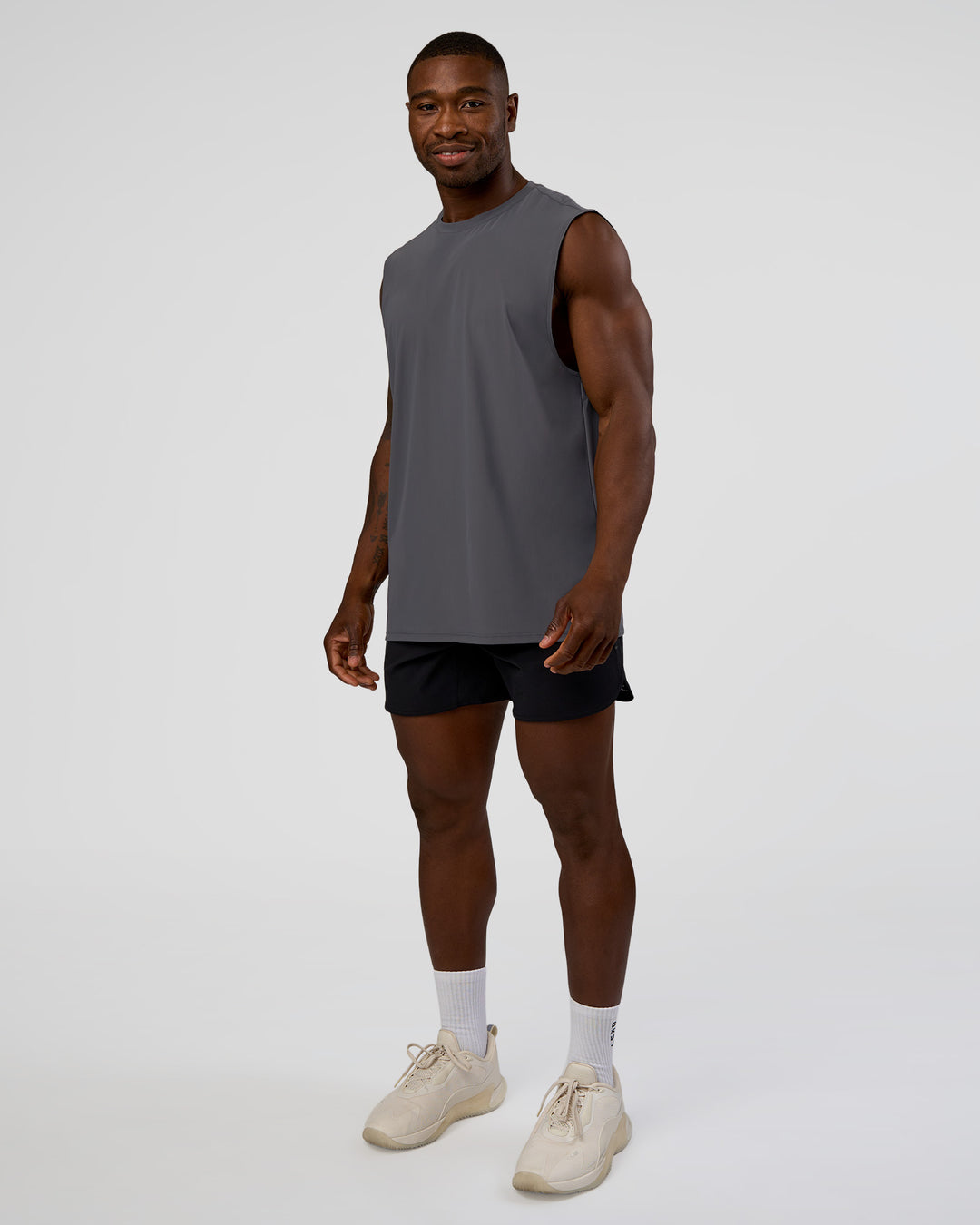 Man wearing Cadence MicroMotion Muscle Tank - Dark Storm | Model:Sam | Size:L - view 5