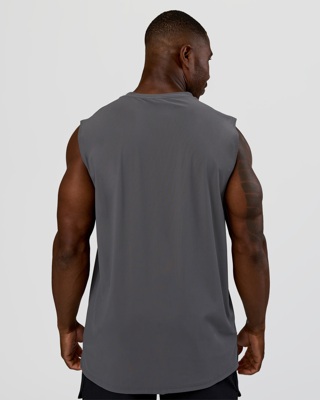 Man wearing Cadence MicroMotion Muscle Tank - Dark Storm | Model:Sam | Size:L - view 3