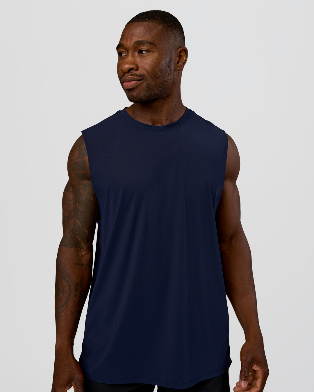Man wearing Cadence MicroMotion Muscle Tank - Future Navy | Model:Sam | Size:L - view 1