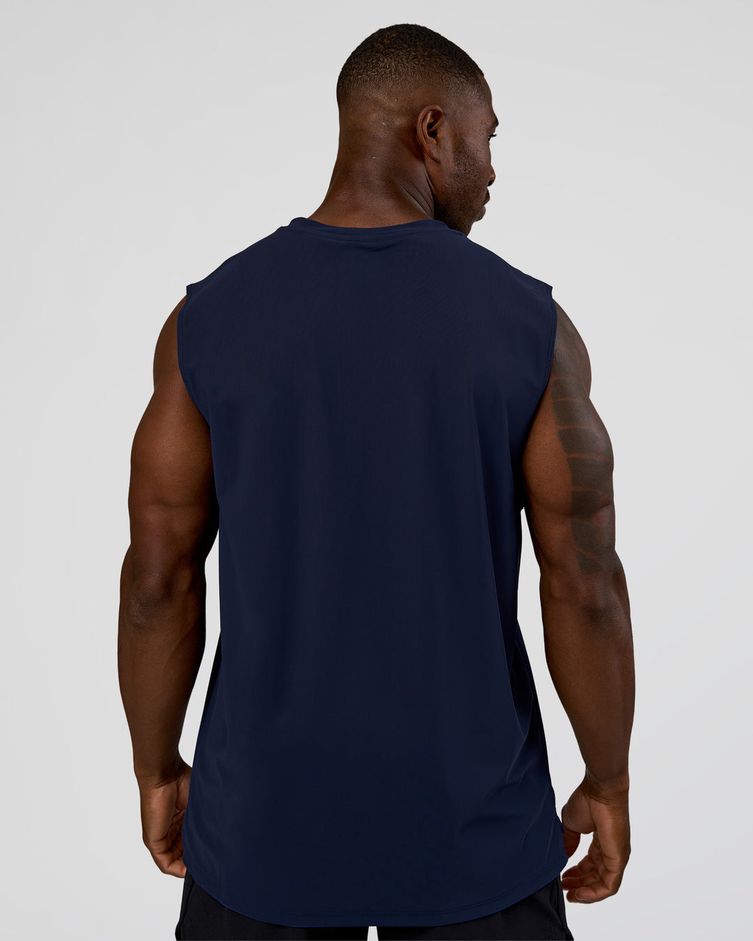 Man wearing Cadence MicroMotion Muscle Tank - Future Navy | Model:Sam | Size:L - view 4