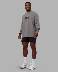 Man wearing Chrome Washed Heavyweight Oversized Long Sleeve Tee - Circular Grey-Black | Model:Sam | Size:L | Thumbnail Index: 4