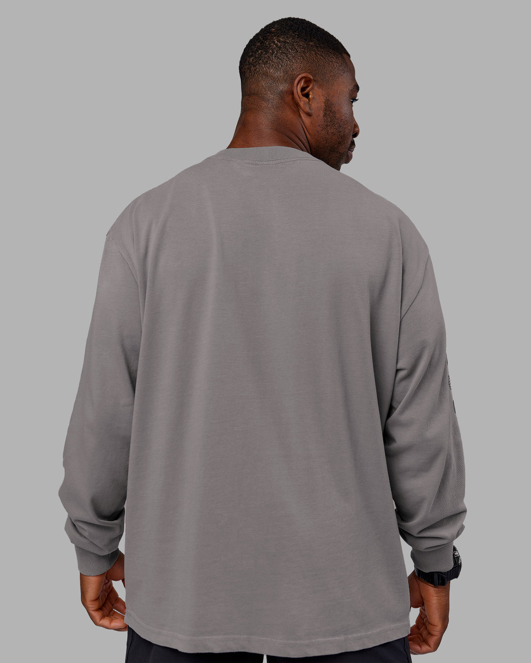 Man wearing Chrome Washed Heavyweight Oversized Long Sleeve Tee - Circular Grey-Black | Model:Sam | Size:L - view 4