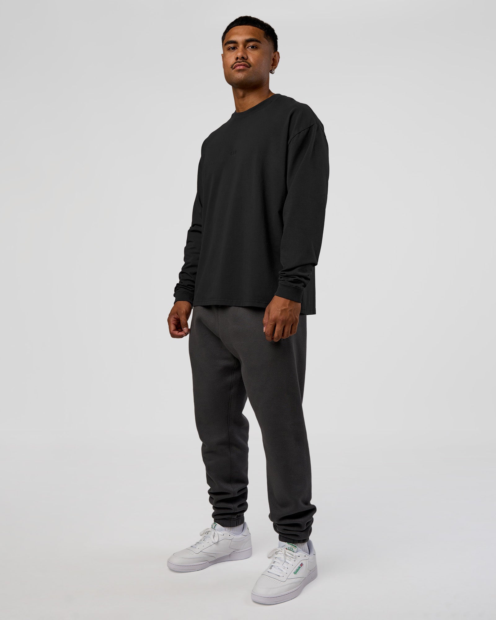 Man wearing Classic Heavyweight FLXCotton Oversized Long Sleeve Tee - Washed Black-Black | Model:Xav | Size:L