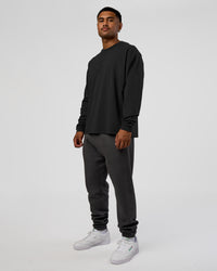 Man wearing Classic Heavyweight FLXCotton Oversized Long Sleeve Tee - Washed Black-Black | Model:Xav | Size:L | Thumbnail Index: 1