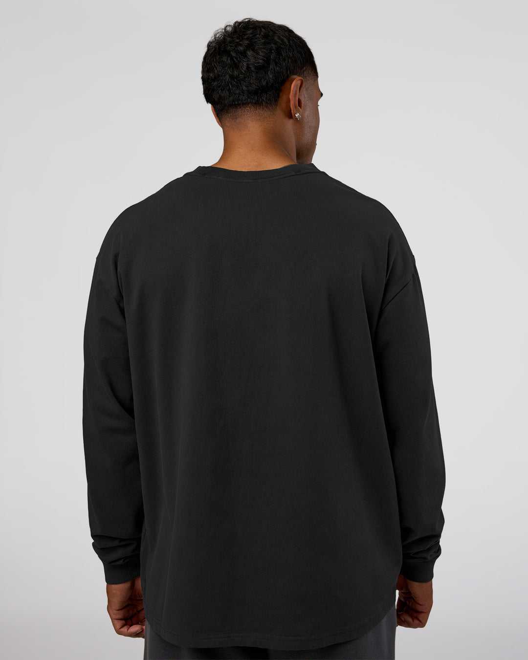Man wearing Classic Heavyweight FLXCotton Oversized Long Sleeve Tee - Washed Black-Black | Model:Xav | Size:L - view 3