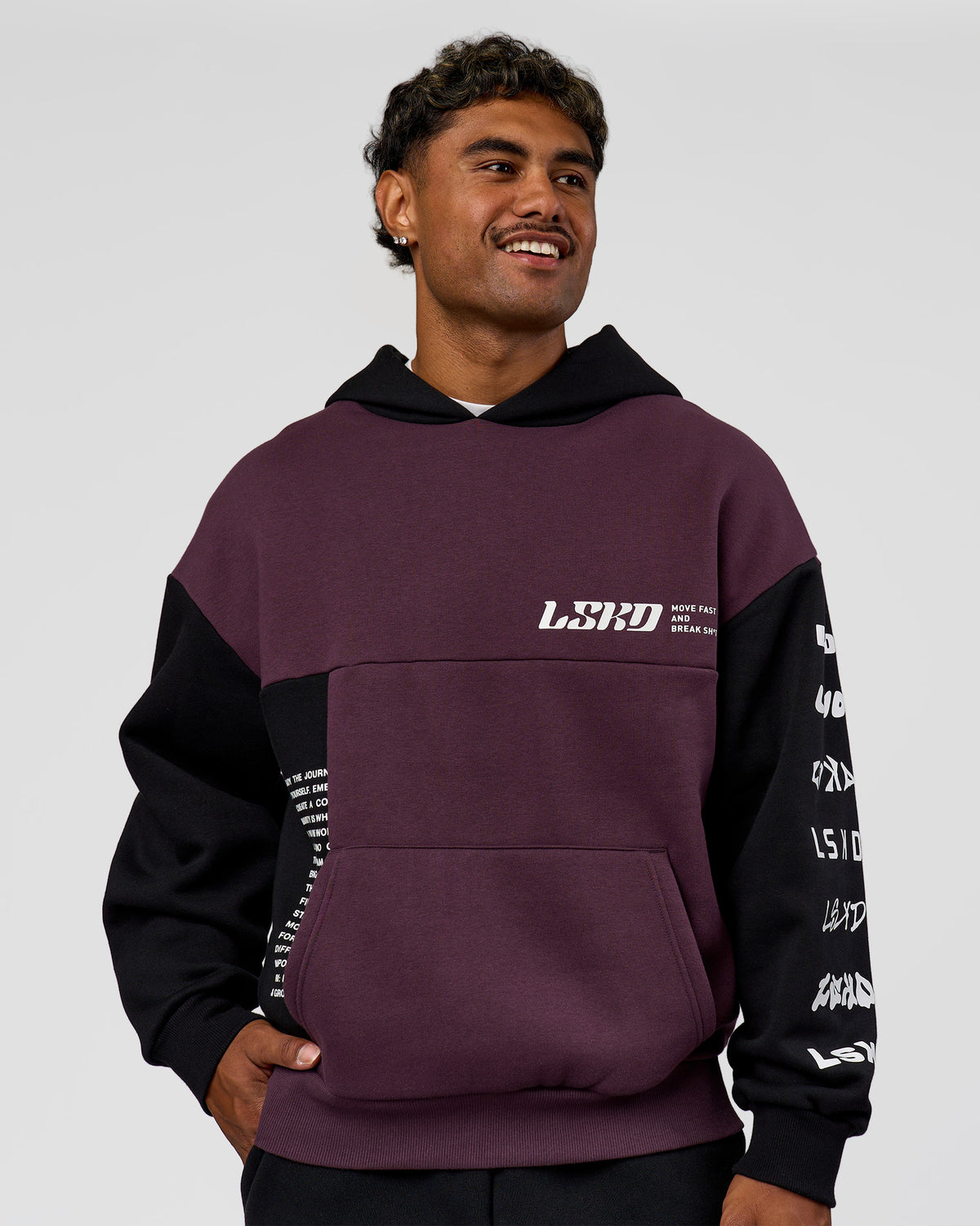 Man wearing Deconstructed Fleece Hoodie - Caviar-Midnight Plum | Model:Xav | Size:L