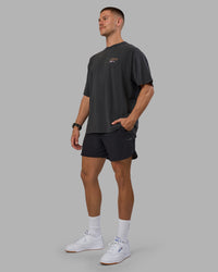 Man wearing Digital World Heavyweight Oversized Tee - Washed Black | Model:Nikola | Size:L | Thumbnail Index: 7