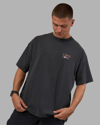 Man wearing Digital World Heavyweight Oversized Tee - Washed Black | Model:Nikola | Size:L | Thumbnail Index: 2