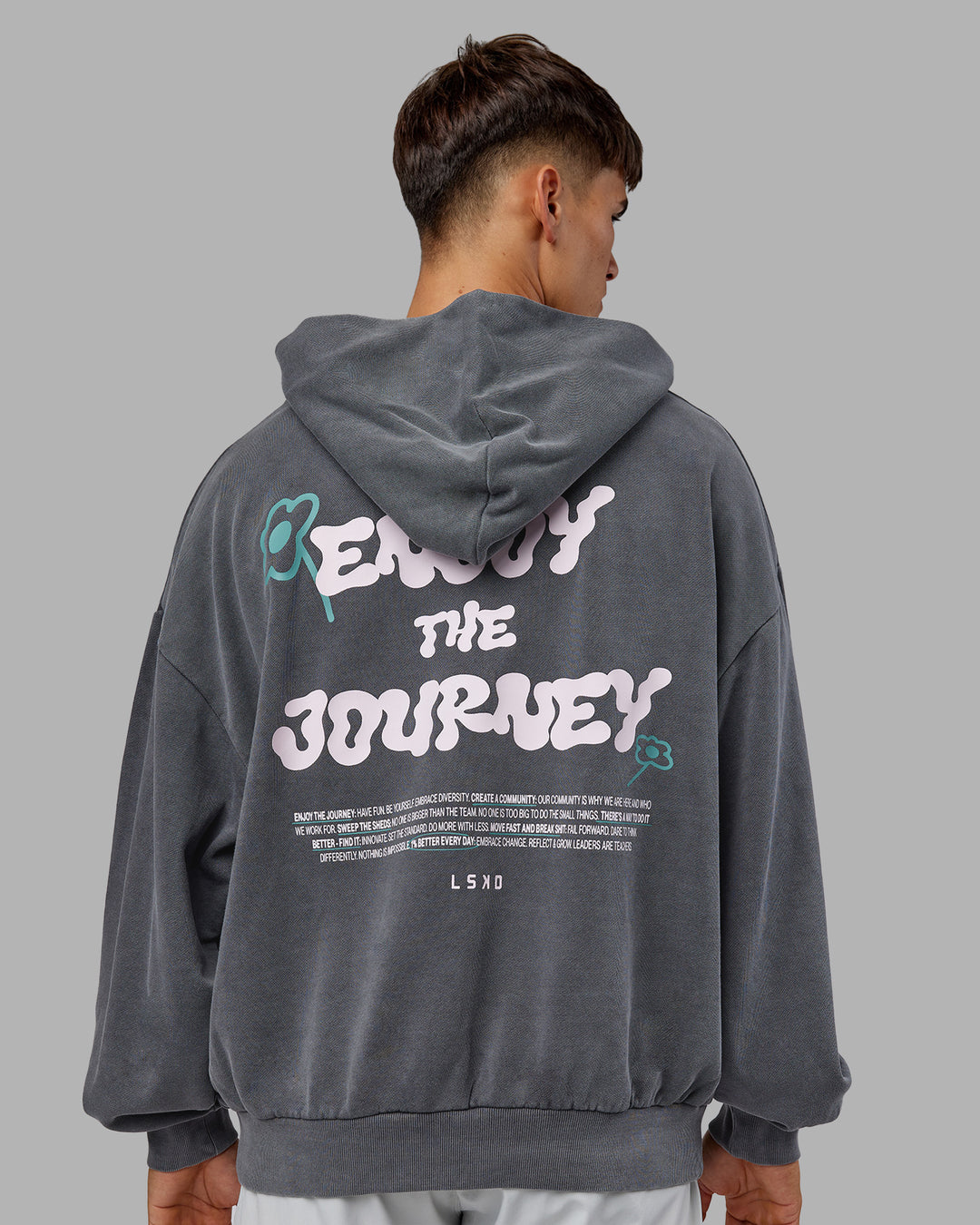 Man wearing ETJ Values Washed Unisex Oversize Hoodie - Dark Storm-Light Bubblegum | Model:Jackson | Size:L - view 1