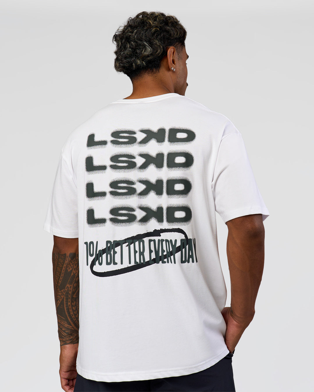 Man wearing Everyday Elevation FLXCotton Oversized Tee - White-Carbon Green | Model:Xav | Size:L - view 1