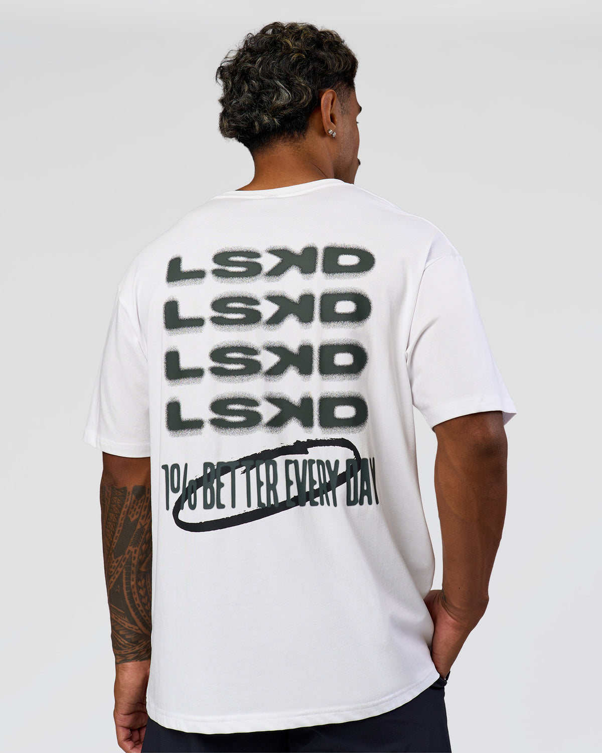 Man wearing Everyday Elevation FLXCotton Oversized Tee - White-Carbon Green | Model:Xav | Size:L