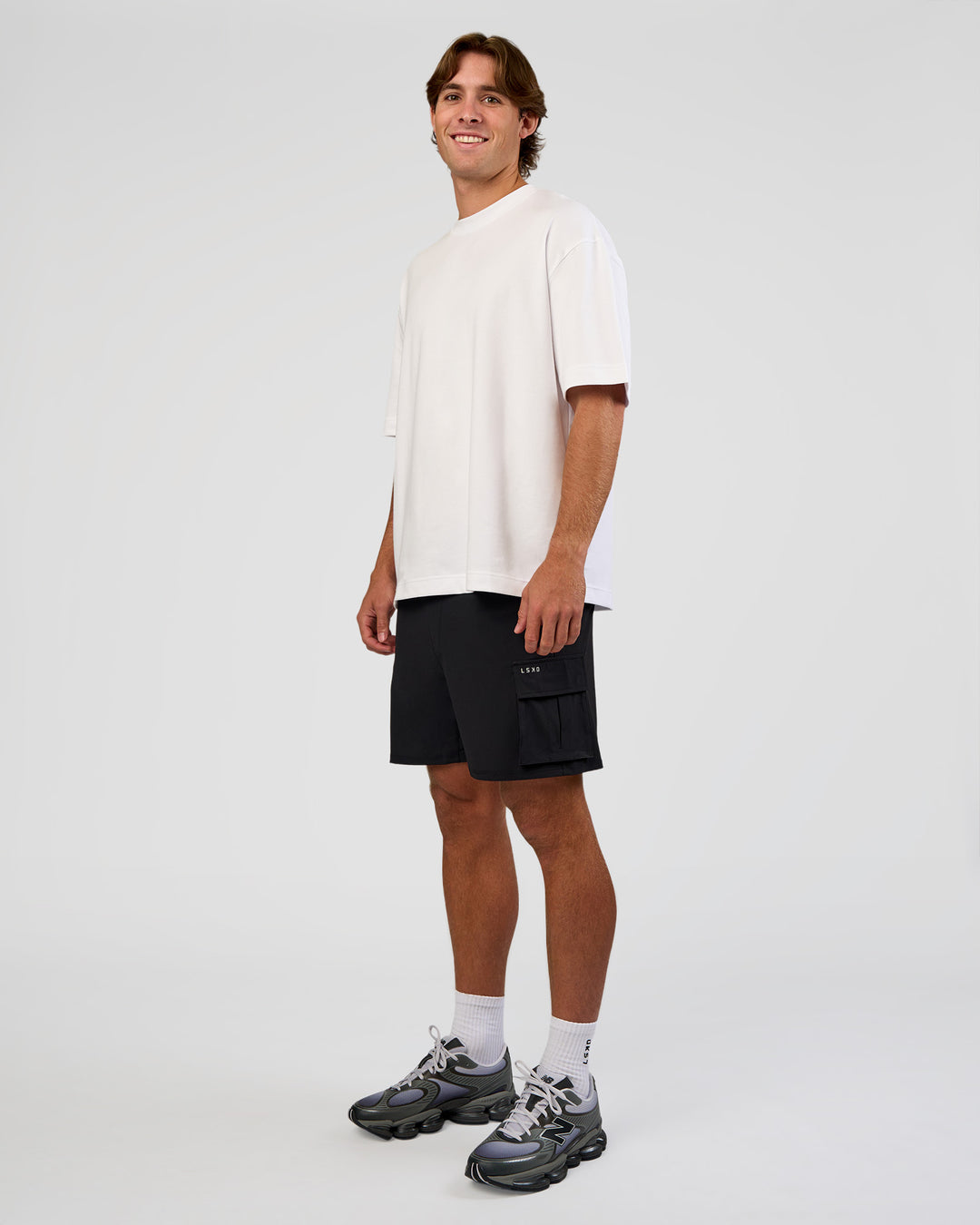 Man wearing Functional Cargo 6" Short - Black | Model:Marcus | Size:L - view 9