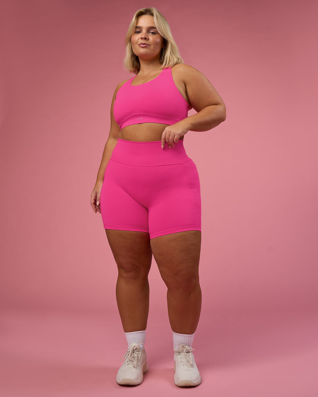 Woman wearing Fusion Ultra High-Rise 6" Short Pockets - Ultra Pink | Model:Bianca | Size:L - view 6