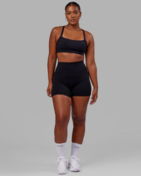 Woman wearing O.G. Fusion Ultra High-Rise 4" Short Pockets - Black | Model:Sierra | Size:L | Thumbnail Index: 0