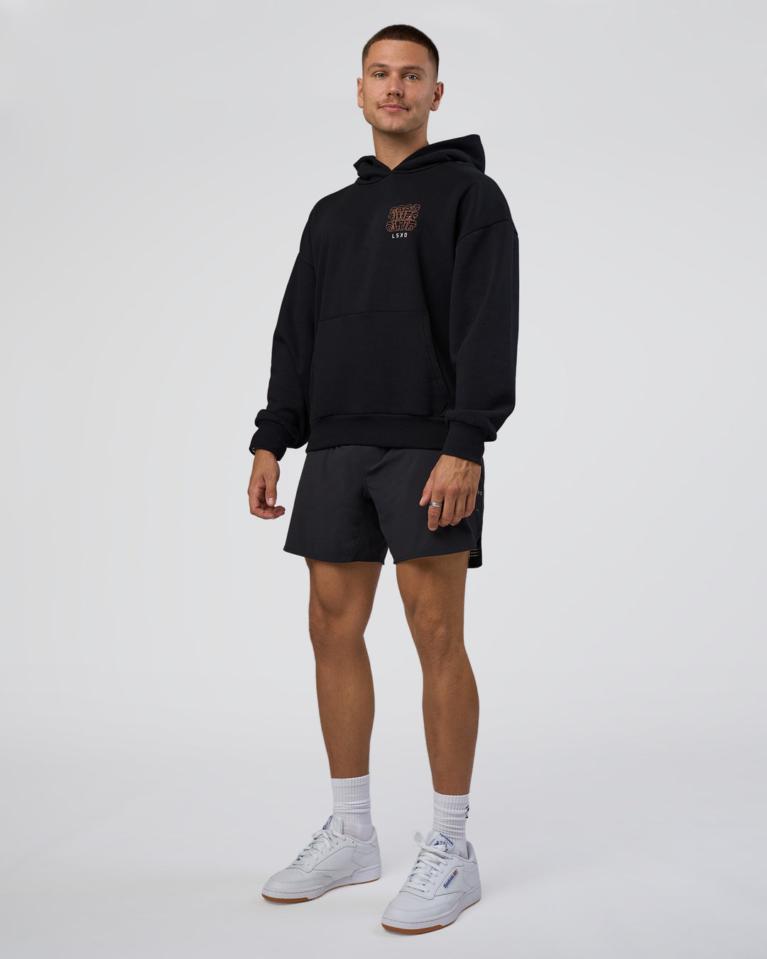 Man wearing GTC CVC Fleece Unisex Oversized Hoodie - Black-Cantaloupe | Model:Nikola | Size:L - view 5