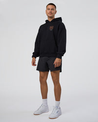 Man wearing GTC CVC Fleece Unisex Oversized Hoodie - Black-Cantaloupe | Model:Nikola | Size:L | Thumbnail Index: 4