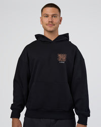 Man wearing GTC CVC Fleece Unisex Oversized Hoodie - Black-Cantaloupe | Model:Nikola | Size:L | Thumbnail Index: 6