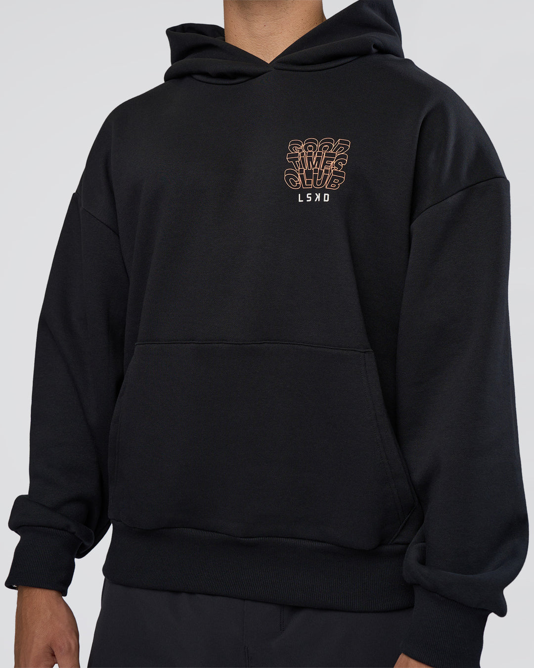 Man wearing GTC CVC Fleece Unisex Oversized Hoodie - Black-Cantaloupe | Model:Nikola | Size:L - view 8