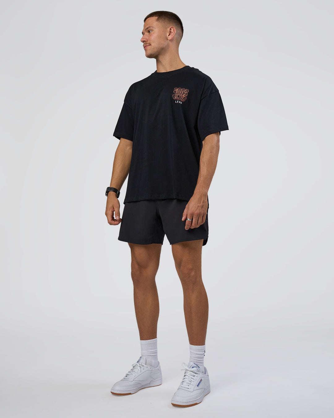 Man wearing GTC Heavyweight Oversized Tee - Black-Cantaloupe | Model:Nikola | Size:L - view 6