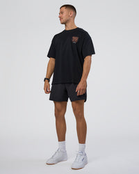 Man wearing GTC Heavyweight Oversized Tee - Black-Cantaloupe | Model:Nikola | Size:L | Thumbnail Index: 5
