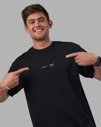Man wearing Good Human Factory Vol 2 FLXCotton Oversize Tee - Black | Model:Cooper | Size:L | Thumbnail Index: 1