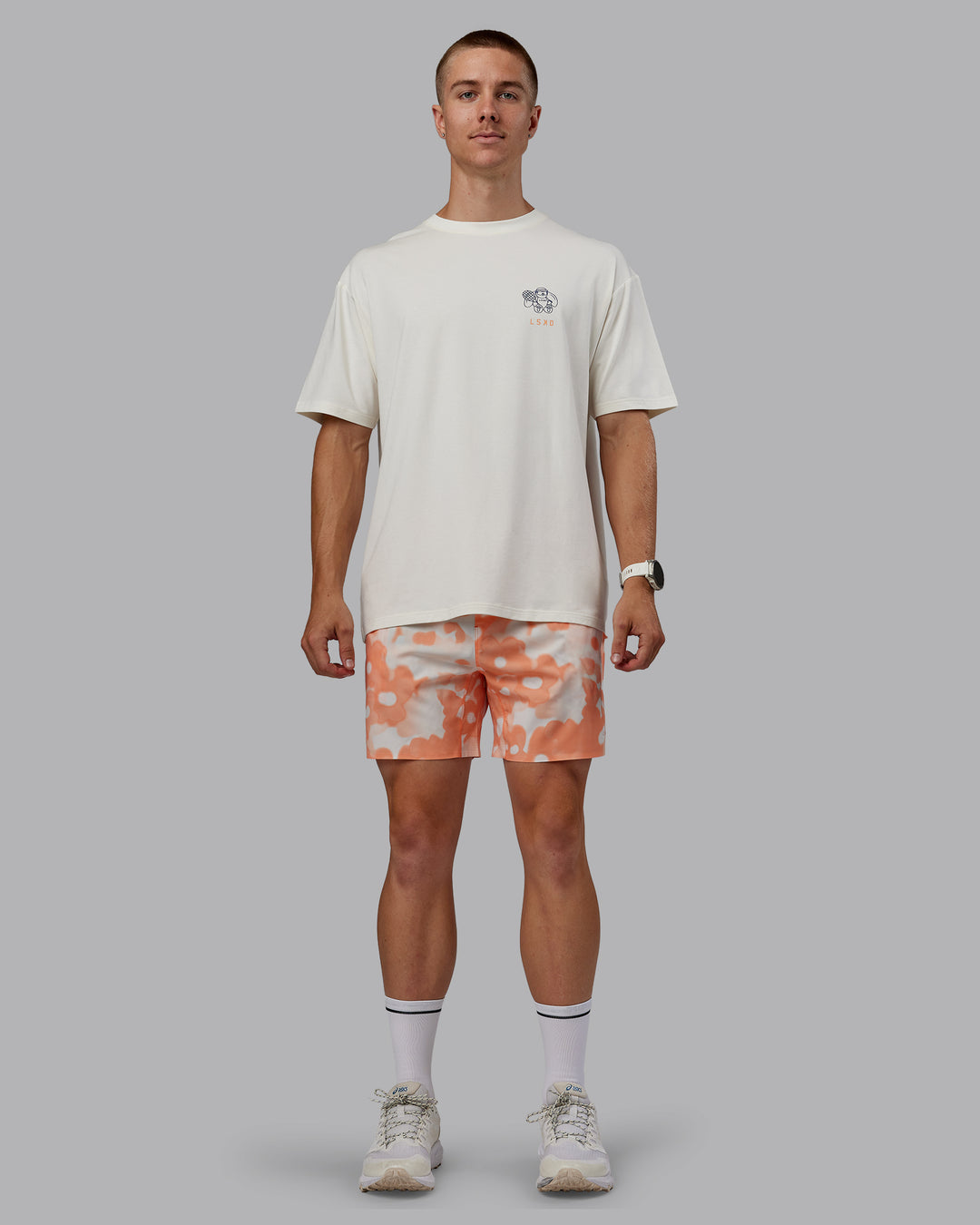 Man wearing Grand Slam 6" Shorts in Wildflower Cantaloupe | Size:L - view 2