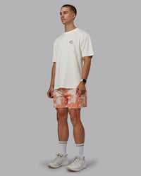 Man wearing Grand Slam 6" Shorts in Wildflower Cantaloupe | Size:L | Thumbnail Index: 4