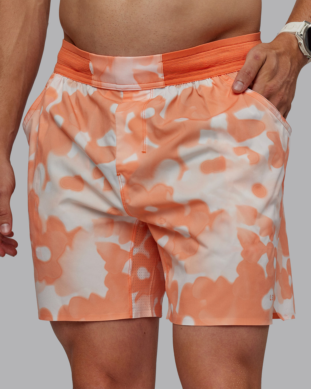 Man wearing Grand Slam 6" Shorts in Wildflower Cantaloupe | Size:L - view 3