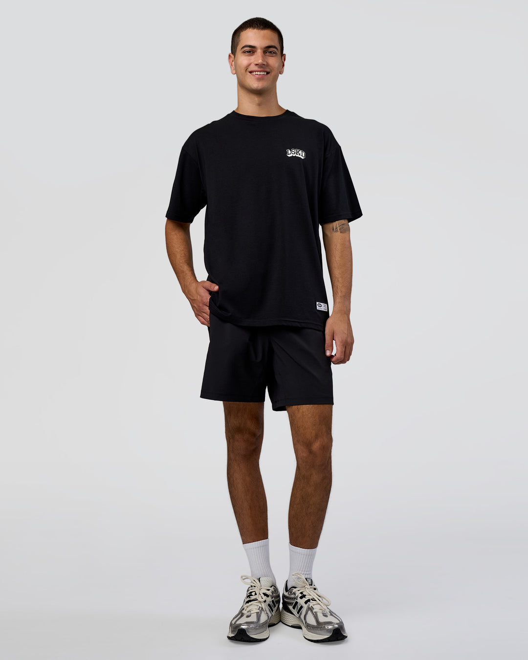 Man wearing Grid FLXCotton Oversized Tee - Black-White | Model:Zoran | Size:L - view 5