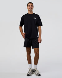 Man wearing Grid FLXCotton Oversized Tee - Black-White | Model:Zoran | Size:L | Thumbnail Index: 4