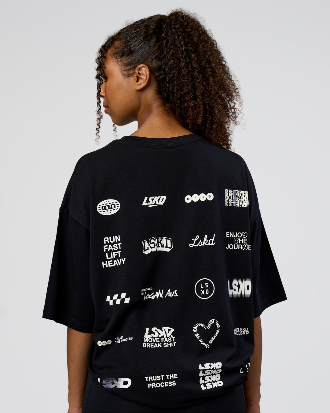 Woman wearing Grid FLXCotton Oversized Tee - Black-White | Model:Jordan | Size:L - view 3