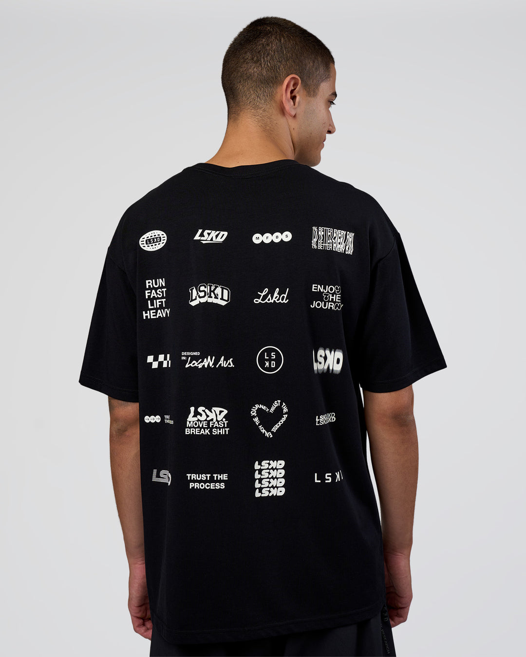 Man wearing Grid FLXCotton Oversized Tee - Black-White | Model:Zoran | Size:L - view 1