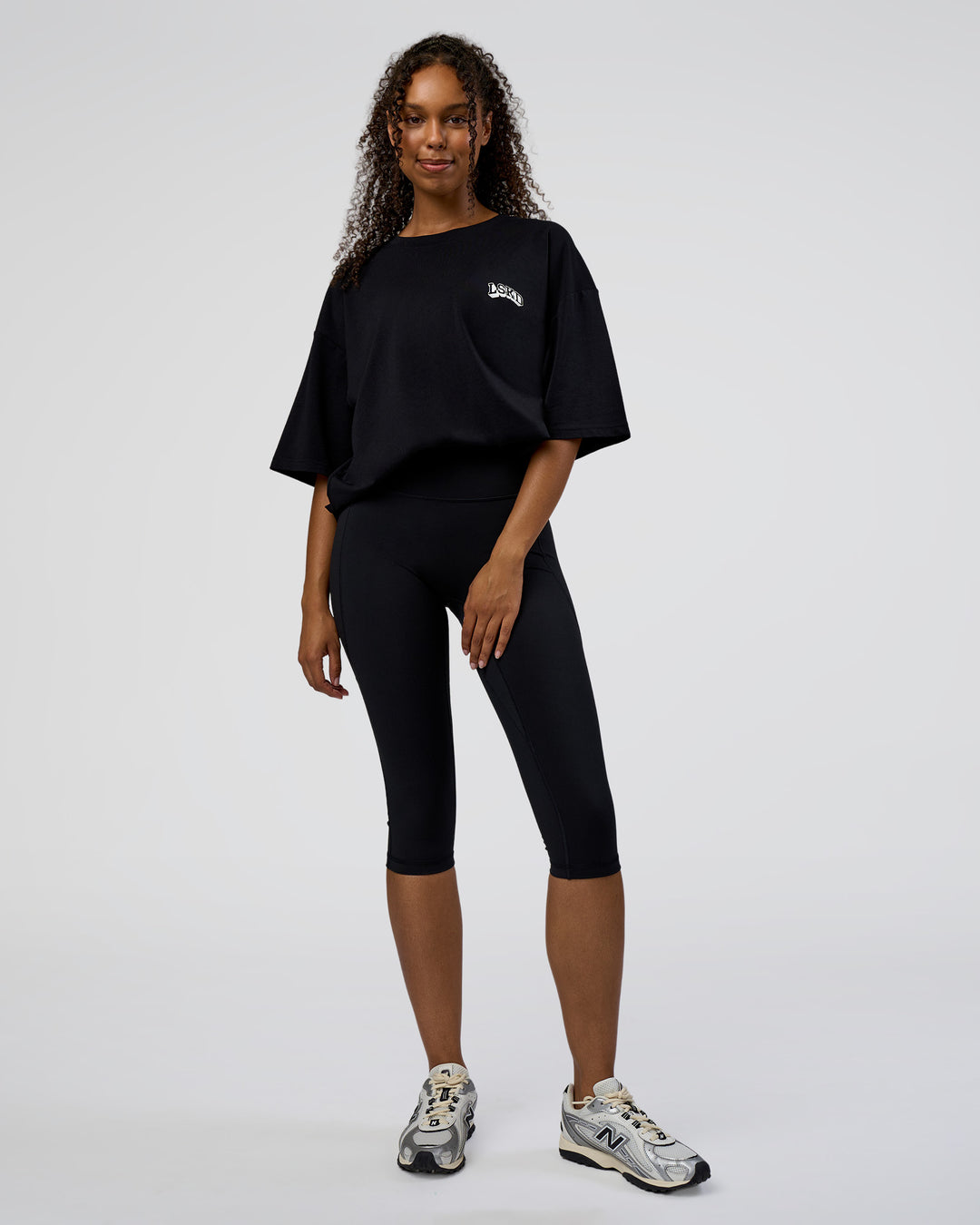 Woman wearing Grid FLXCotton Oversized Tee - Black-White | Model:Jordan | Size:L - view 9