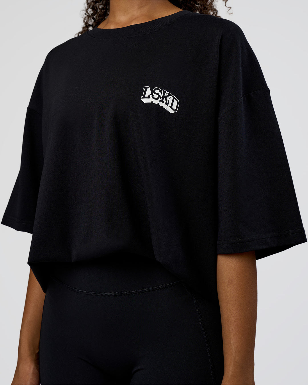 Woman wearing Grid FLXCotton Oversized Tee - Black-White | Model:Jordan | Size:L - view 10