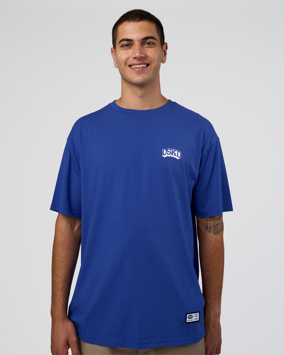Man wearing Grid FLXCotton Oversized Tee - Power Cobalt-White | Model:Zoran | Size:L - view 1