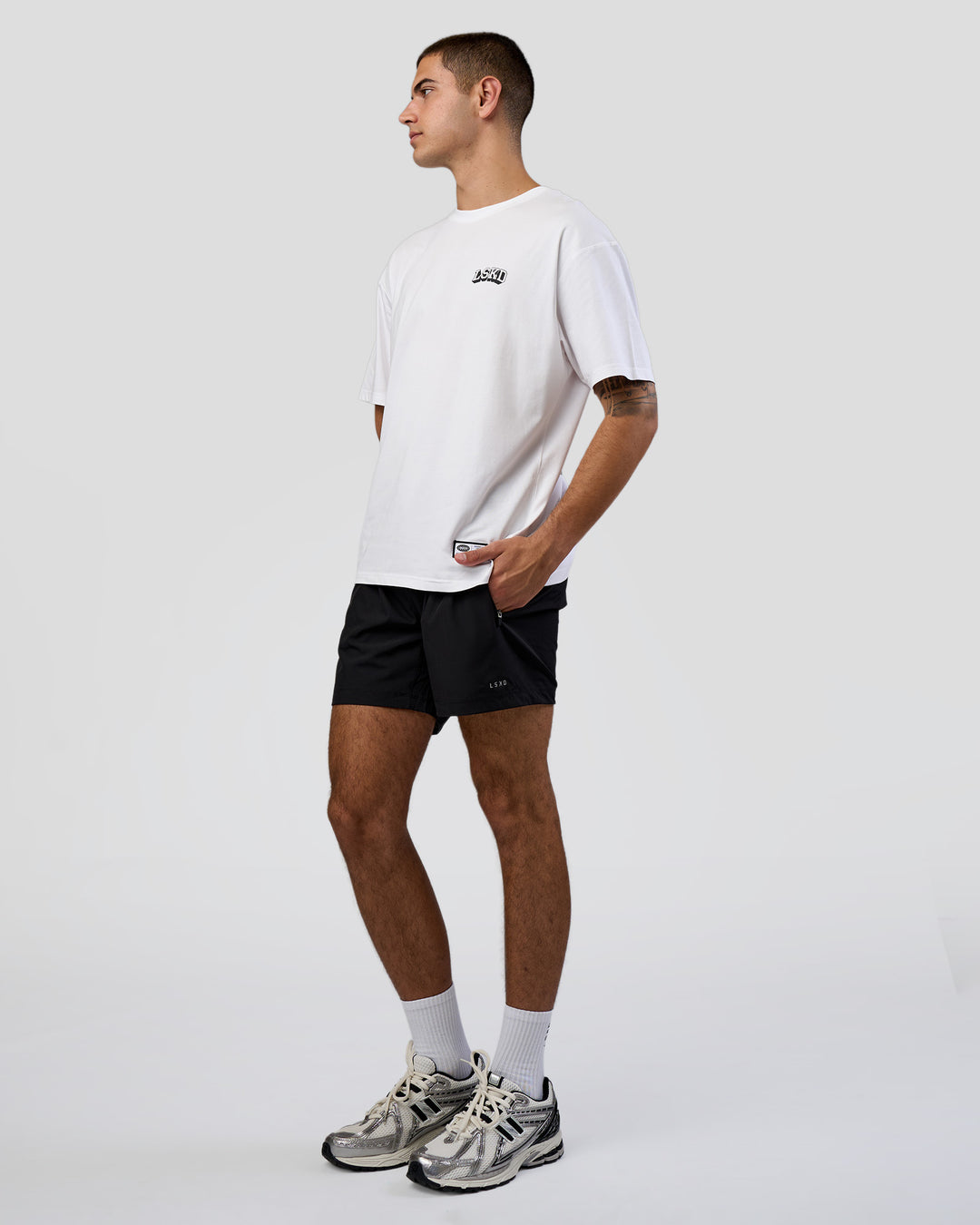 Man wearing Grid FLXCotton Oversized Tee - White-Black | Model:Zoran | Size:L - view 2