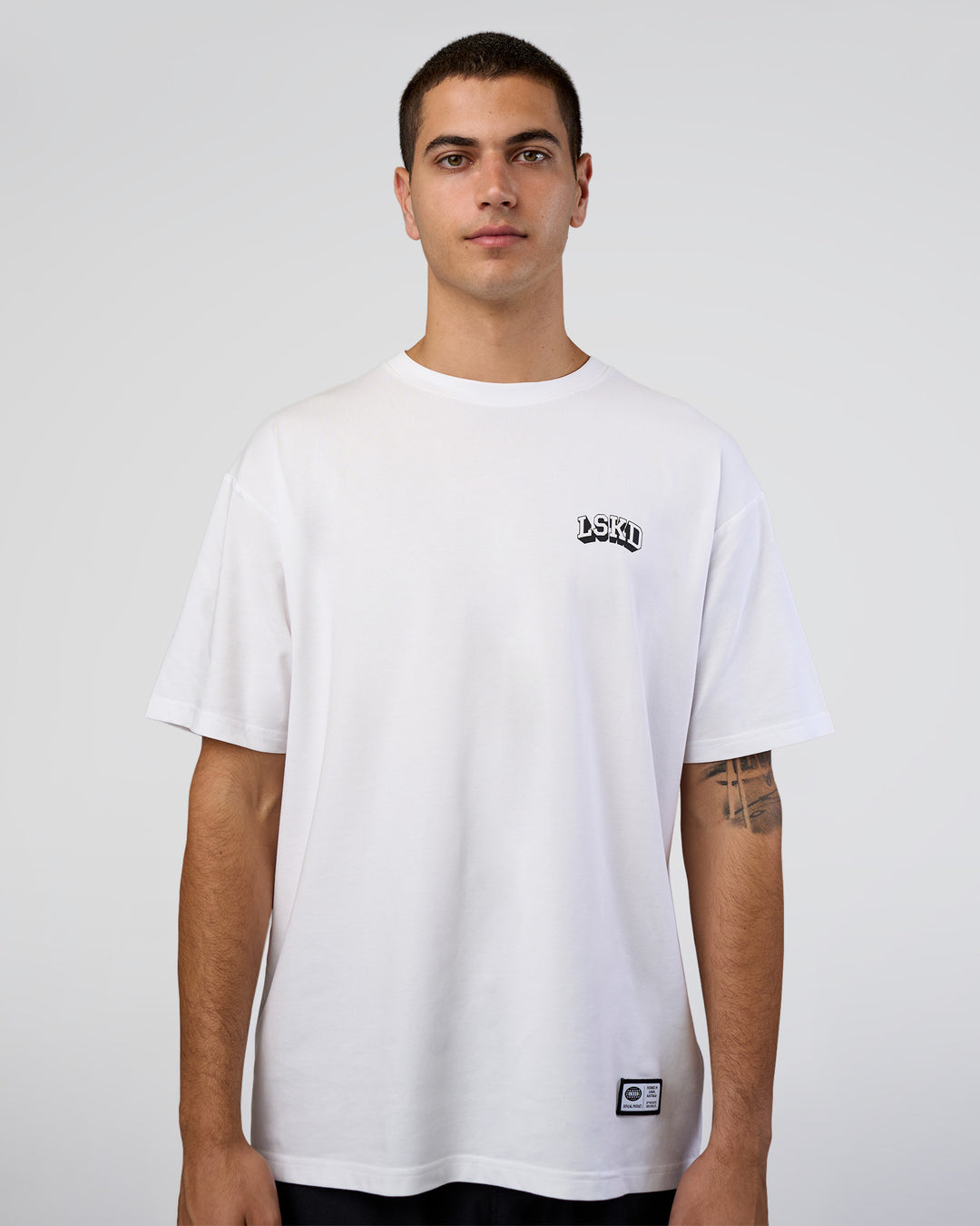 Man wearing Grid FLXCotton Oversized Tee - White-Black | Model:Zoran | Size:L - view 5