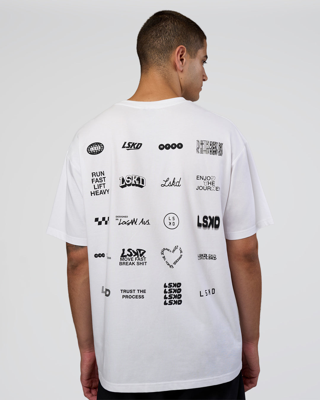 Man wearing Grid FLXCotton Oversized Tee - White-Black | Model:Zoran | Size:L - view 1