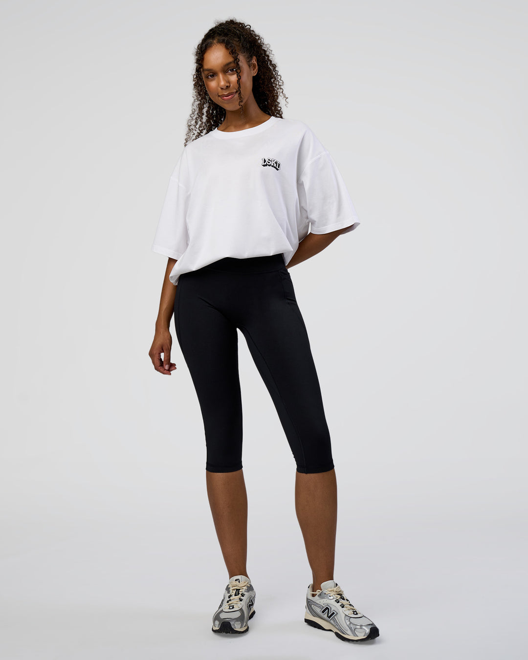 Woman wearing Grid FLXCotton Oversized Tee - White-Black | Model:Jordan | Size:L - view 7