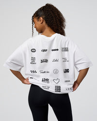 Woman wearing Grid FLXCotton Oversized Tee - White-Black | Model:Jordan | Size:L | Thumbnail Index: 2