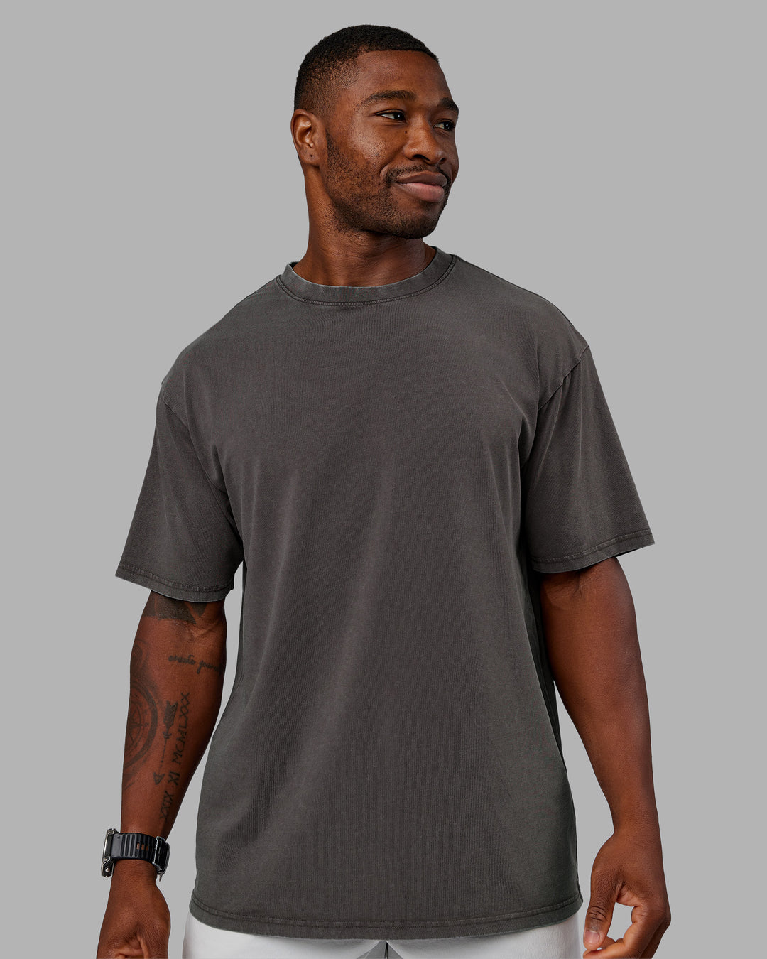 Man wearing Heart FLXCotton Oversized Tee - Washed Dark Storm-Violet Ray | Model:Sam | Size:L - view 4